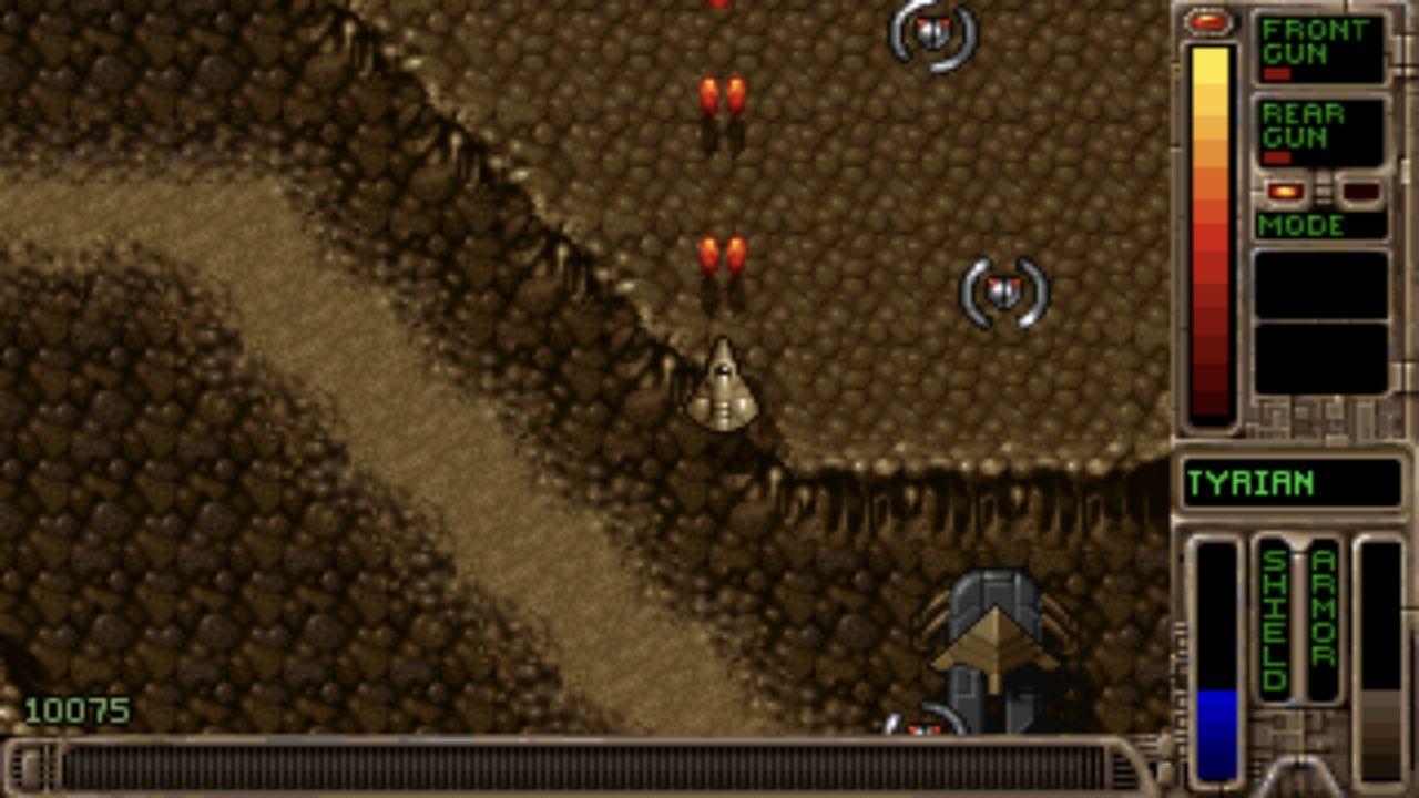 Actual OpenTyrian first-level scene with the player ship, scrolling terrain and weapon and shield panels
