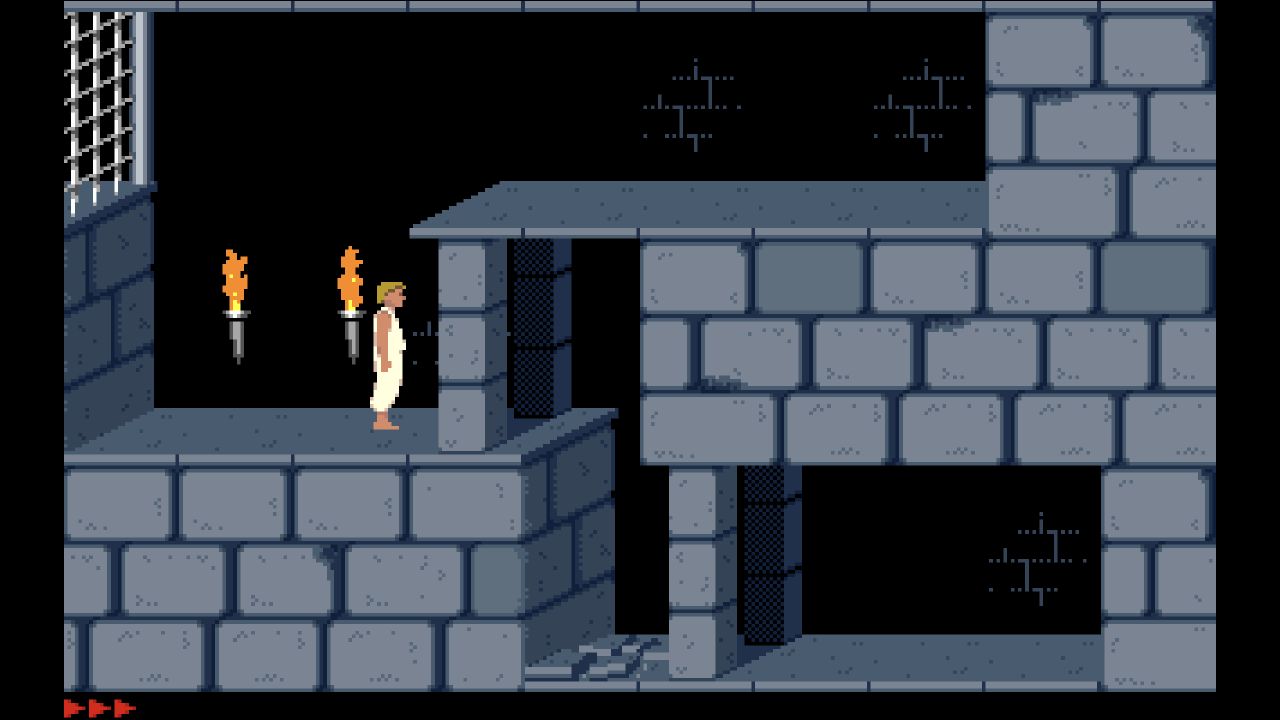 PrinceJS dungeon scene after right-arrow input moved the prince beside two torches
